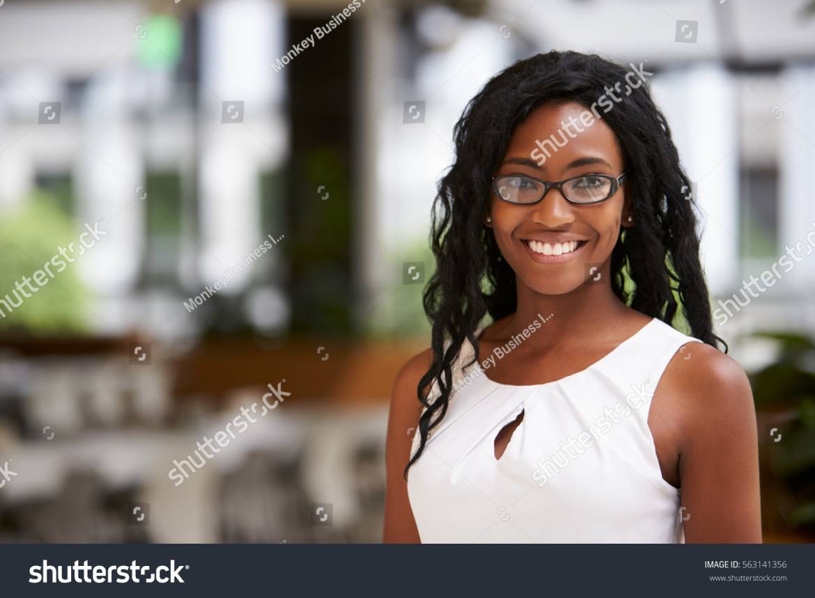 stock-photo-portrait-of-young-black-businesswoman-wearing-glasses-563141356.jpg